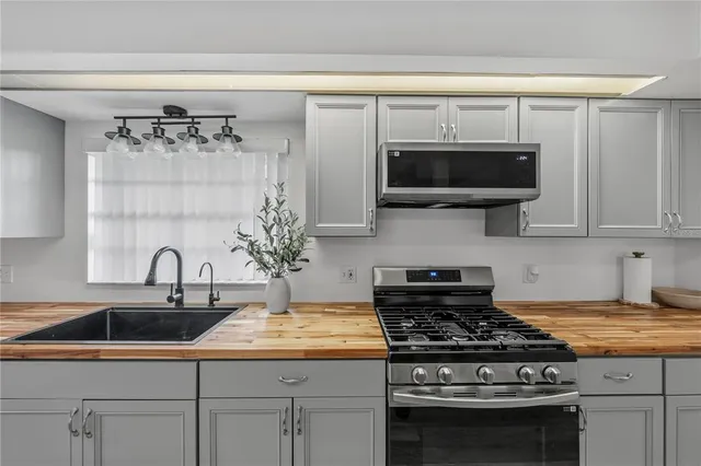 a bathroom with a sink double vanity and a mirror