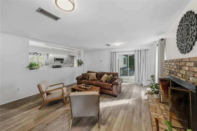 a kitchen with granite countertop lots of counter top space a sink and a window