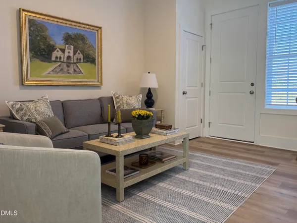 a living room with furniture and a window
