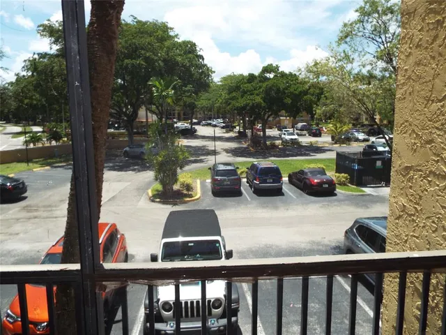 a view of swimming pool from a balcony