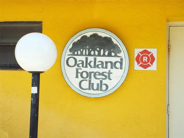 a view of a swimming pool with outdoor seating