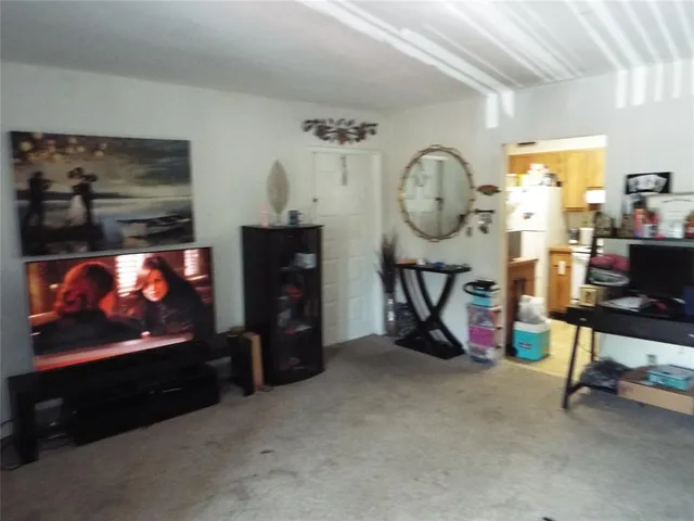 a room with furniture and a flat screen tv