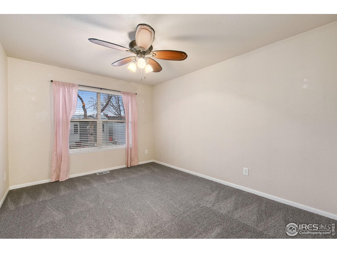3217 Baldwin Avenue Evans, CO 80620 - Photo 14 of 28 a view of an empty room with a window