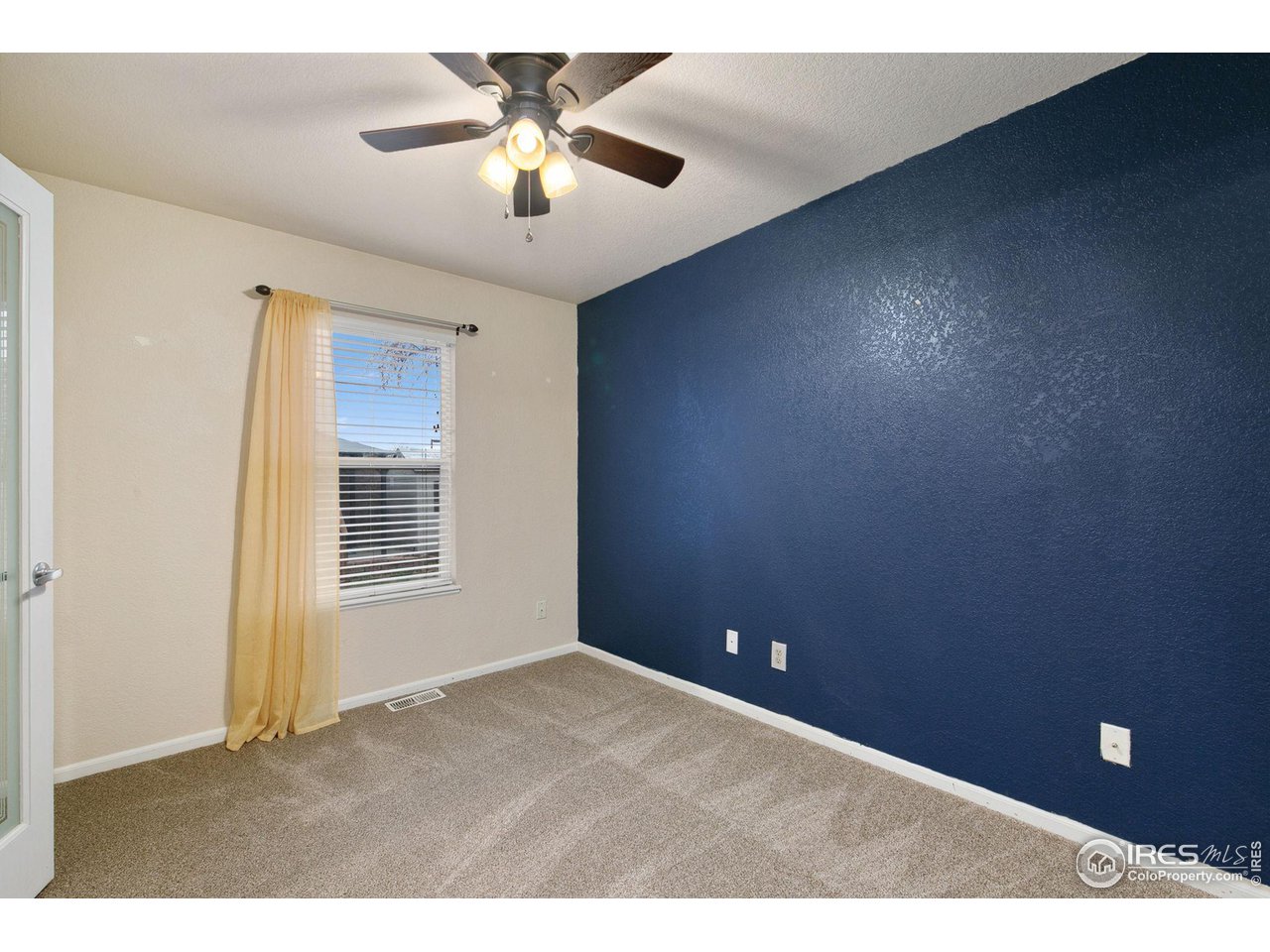 3217 Baldwin Avenue Evans, CO 80620 - Photo 16 of 28 a view of an empty room with a window