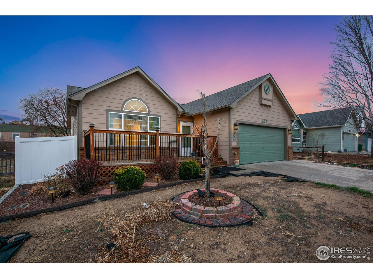3217 Baldwin Avenue Evans, CO 80620 - Photo 2 of 28 a front view of a house with garden