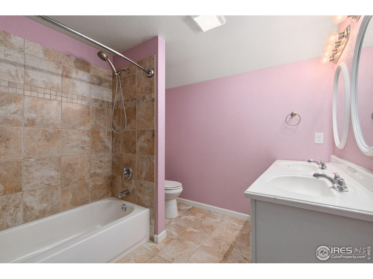 3217 Baldwin Avenue Evans, CO 80620 - Photo 21 of 28 a bathroom with a sink a toilet a bathtub and shower