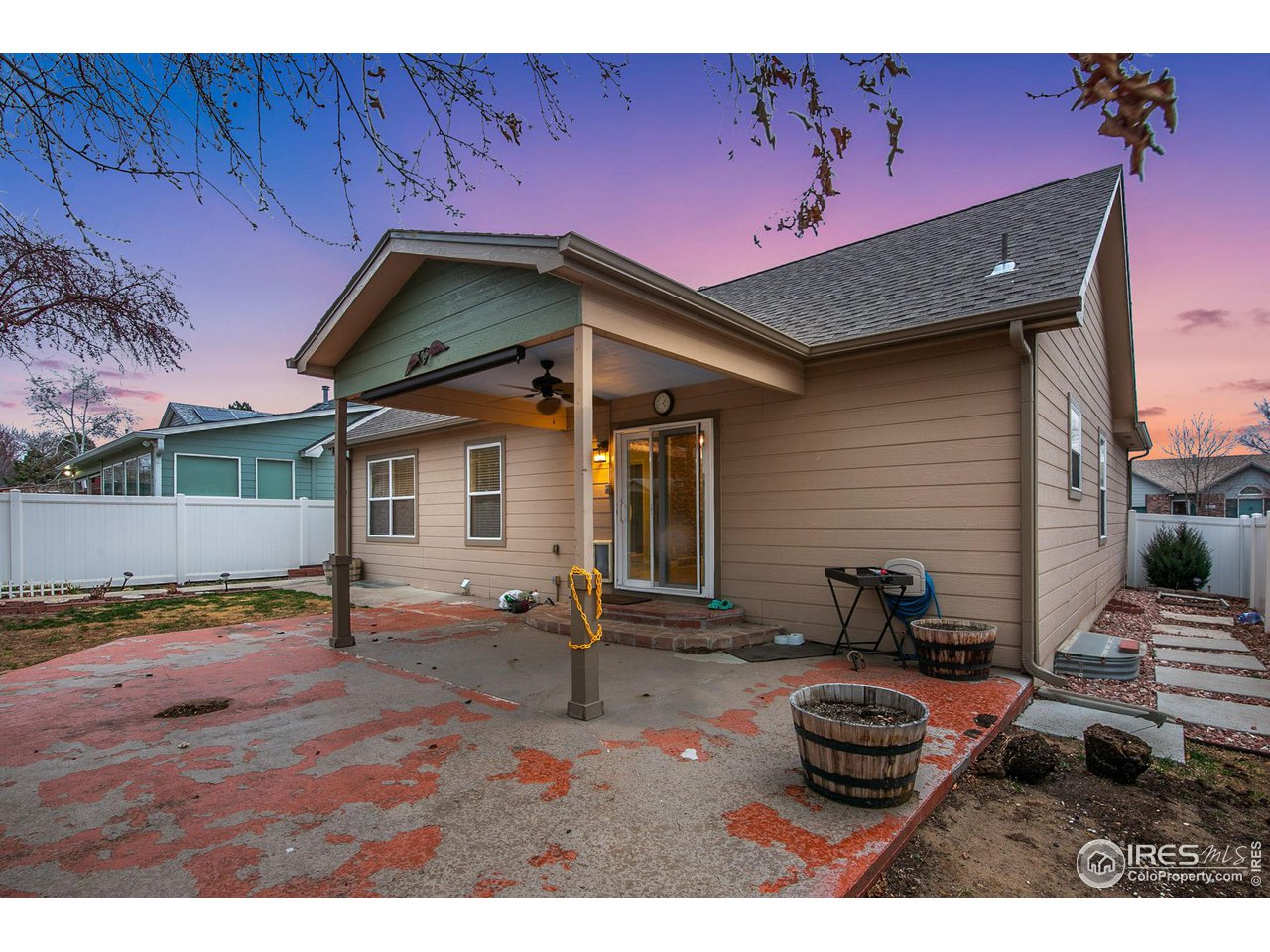 3217 Baldwin Avenue Evans, CO 80620 - Photo 27 of 28 a backyard of a house with table and chairs