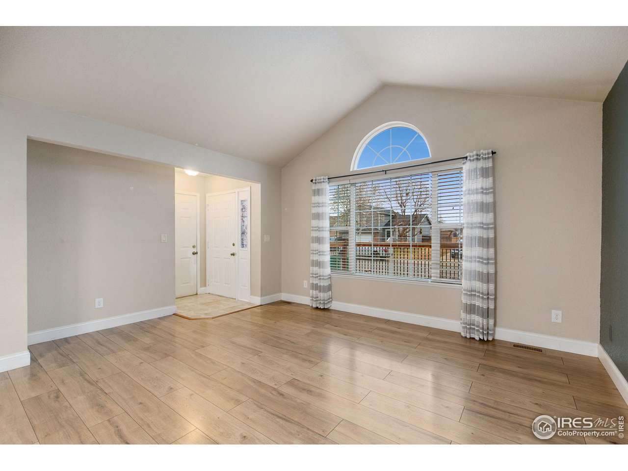 3217 Baldwin Avenue Evans, CO 80620 - Photo 7 of 28 a view of an empty room with a window