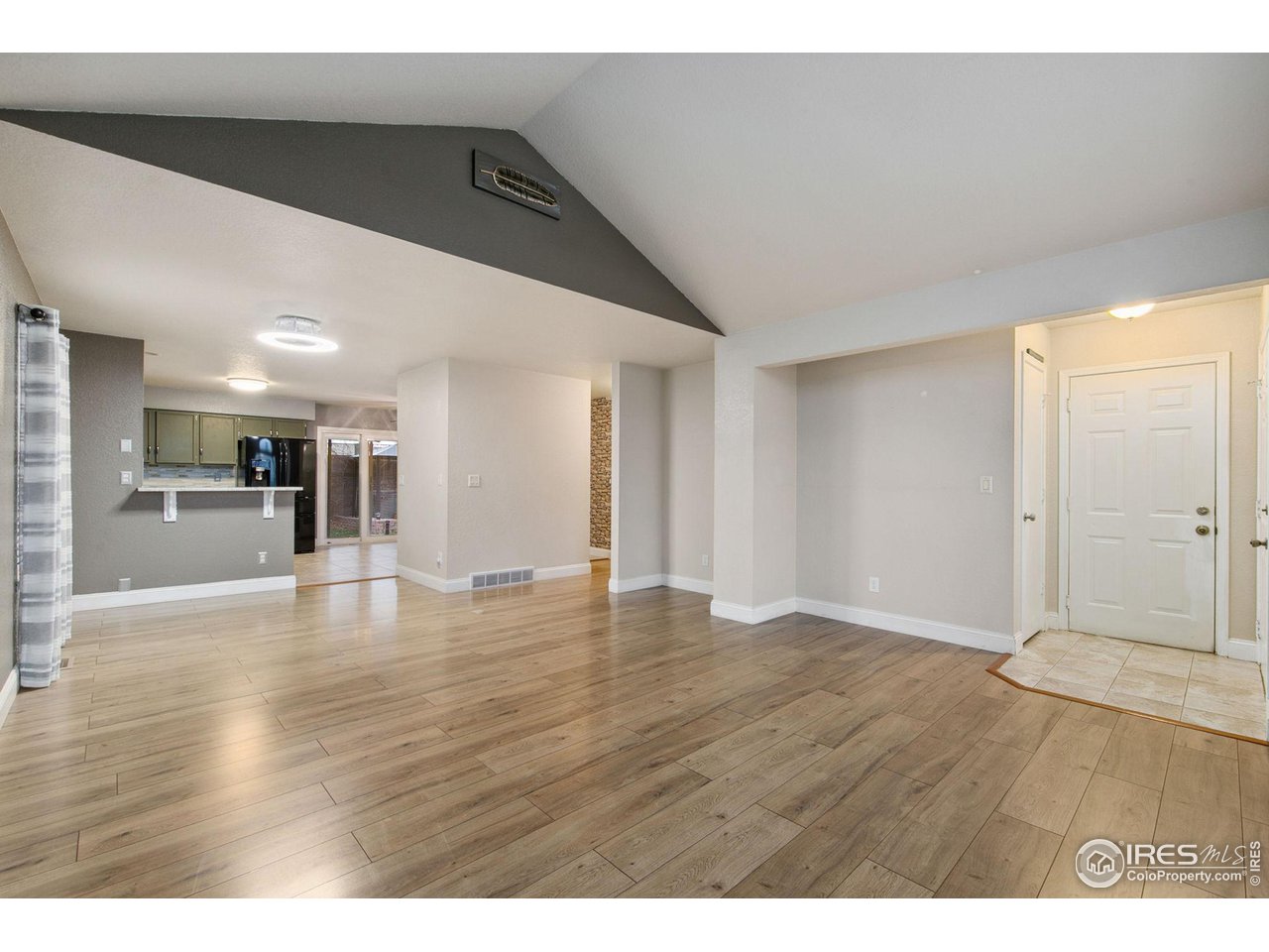 3217 Baldwin Avenue Evans, CO 80620 - Photo 8 of 28 a view of empty room with wooden floor