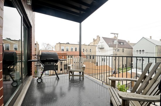 2038 West Iowa Street, Unit 2W Chicago, IL 60622 - Photo 11 of 11 a view of a balcony with chairs