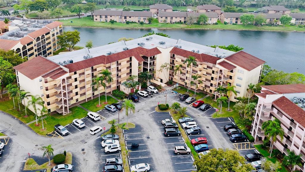 3955 North Nob Hill Road, Unit 404 Sunrise, FL 33351 - Photo 12 of 14 an aerial view of a house with a lake view
