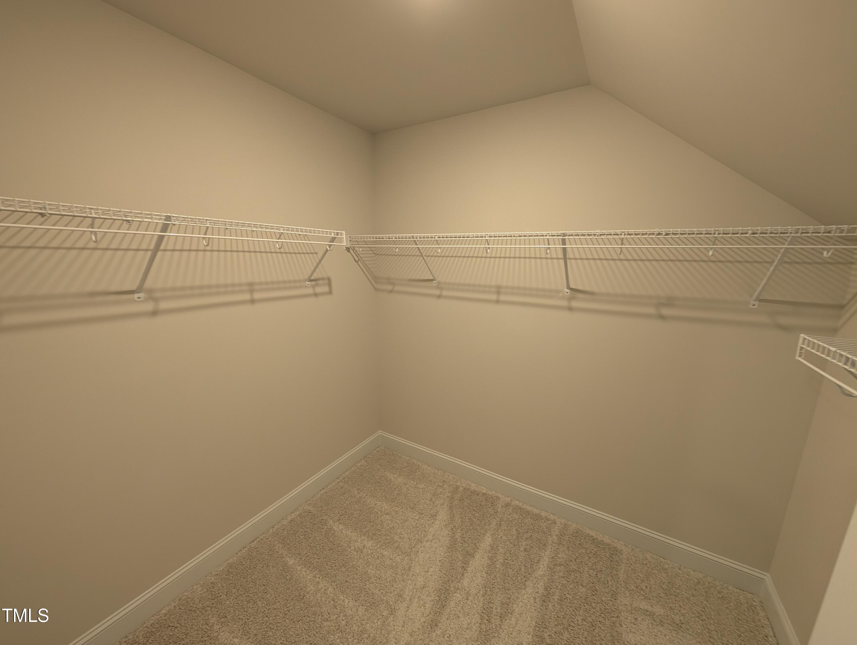 46 Steppe Way Garner, NC 27529 - Photo 17 of 31 a view of a room with racks on the wall