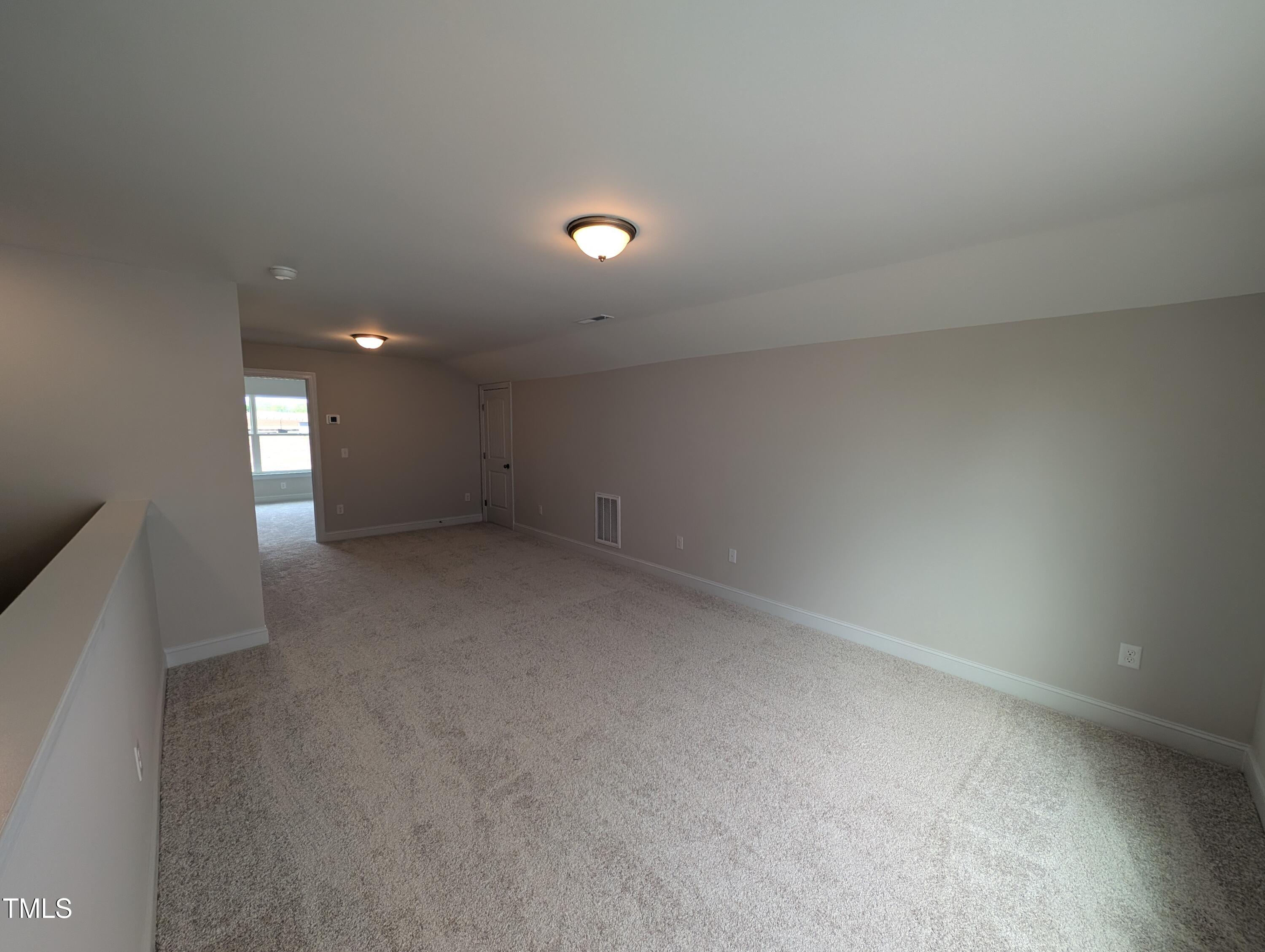 46 Steppe Way Garner, NC 27529 - Photo 18 of 31 a view of an empty room with a window