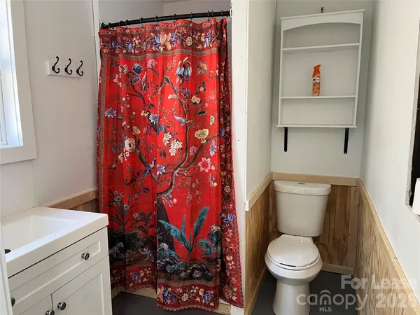 a bathroom with a toilet and a sink