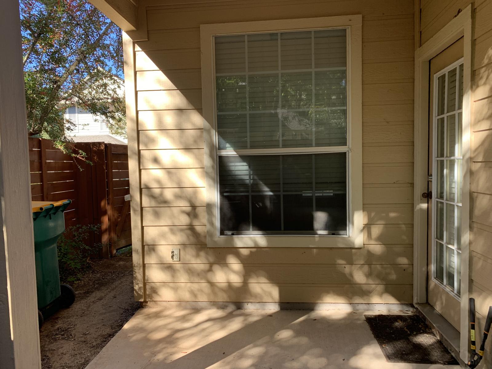 11000 Anderson Mill Road, Unit 29 Austin, TX 78750 - Photo 7 of 27 a front view of a house with a glass door