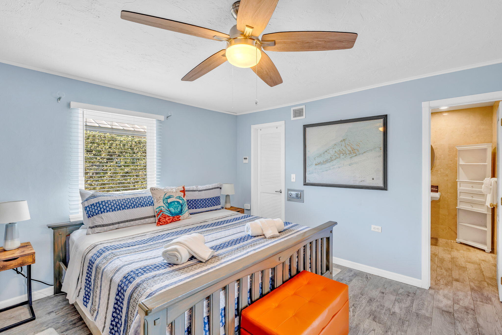 600 12th Street Key Colony Beach, FL 33051 - Photo 14 of 40 a bedroom with a bed and a chandelier