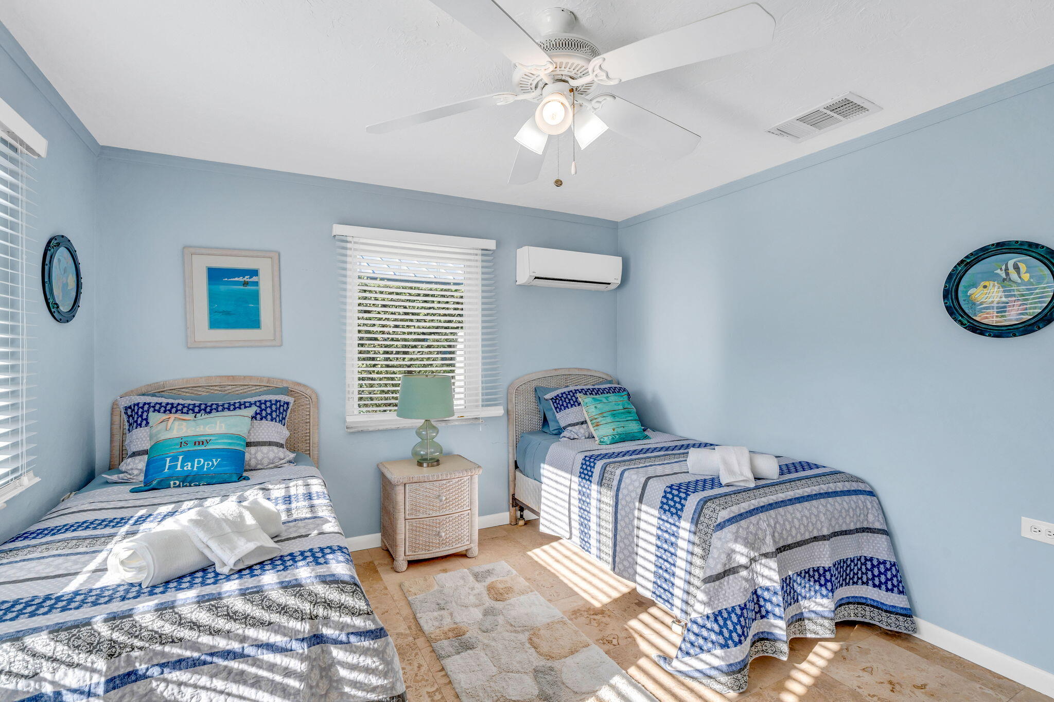 600 12th Street Key Colony Beach, FL 33051 - Photo 23 of 40 a bedroom with a bed and a chandelier