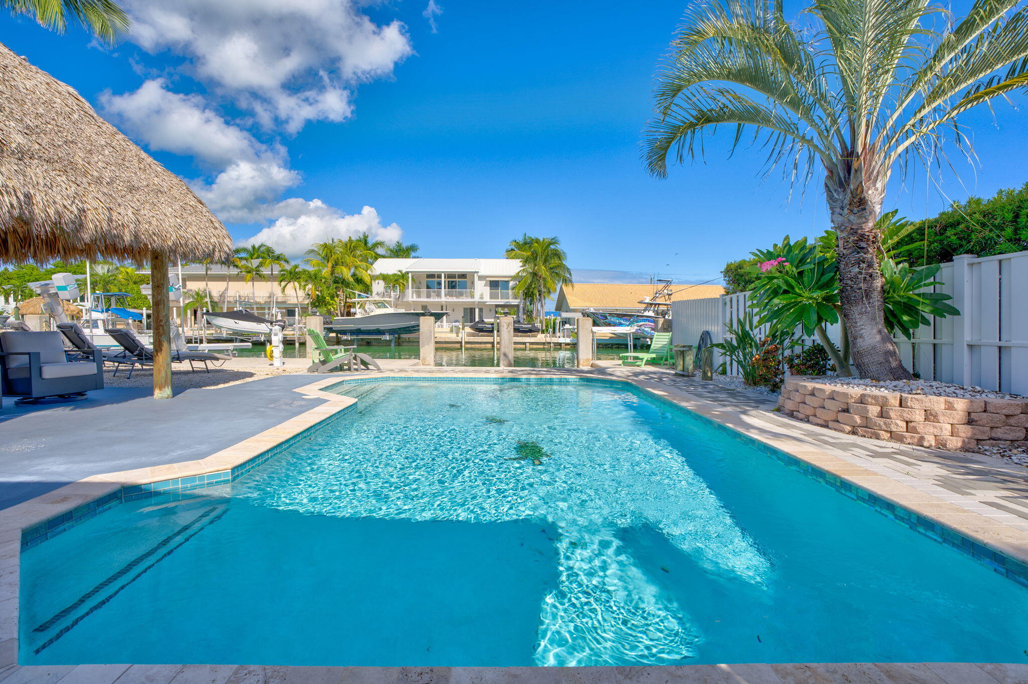 600 12th Street Key Colony Beach, FL 33051 - Photo 34 of 40 a view of a swimming pool with a patio