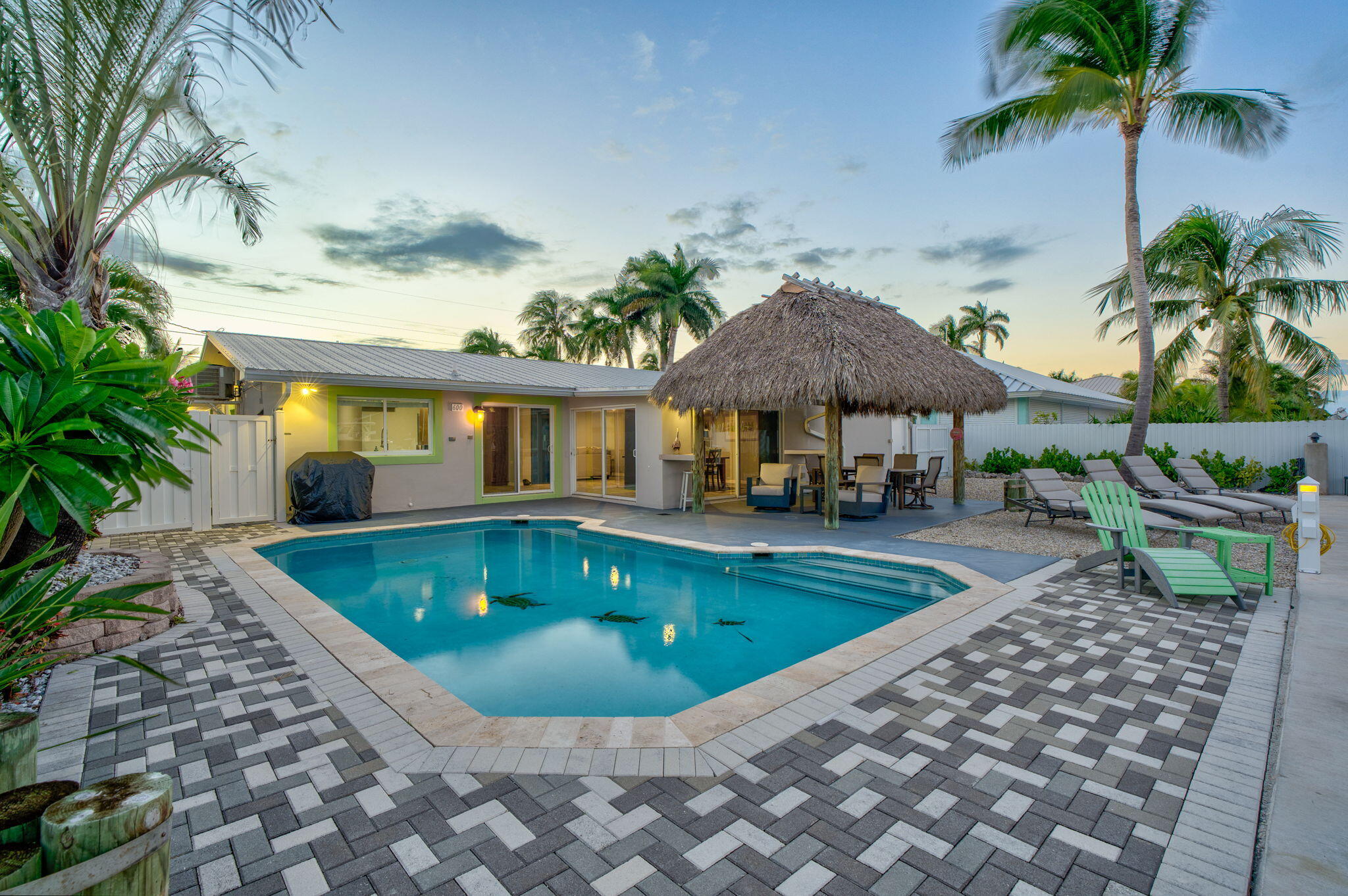 600 12th Street Key Colony Beach, FL 33051 - Photo 38 of 40 a view of a house with swimming pool and sitting area
