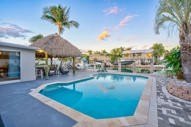 a view of a swimming pool with a patio