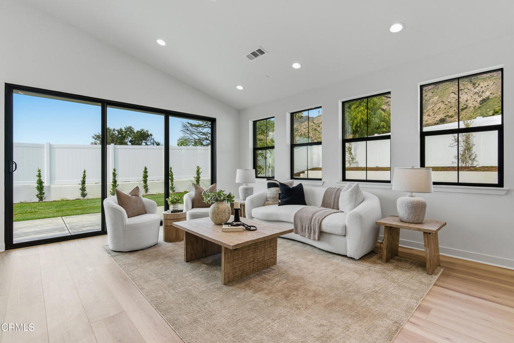 3245 Arrowhead Court Altadena, CA 91001 - Photo 13 of 37 a living room with furniture couches and large window with outer view