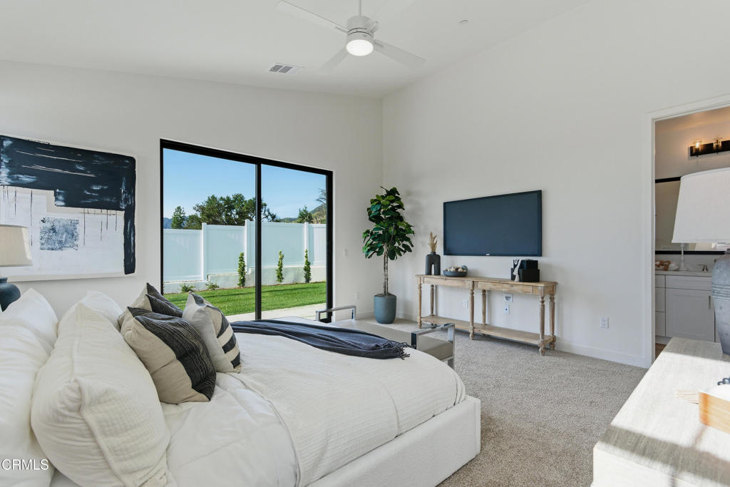 3245 Arrowhead Court Altadena, CA 91001 - Photo 16 of 37 a bedroom with a bed and a flat screen tv