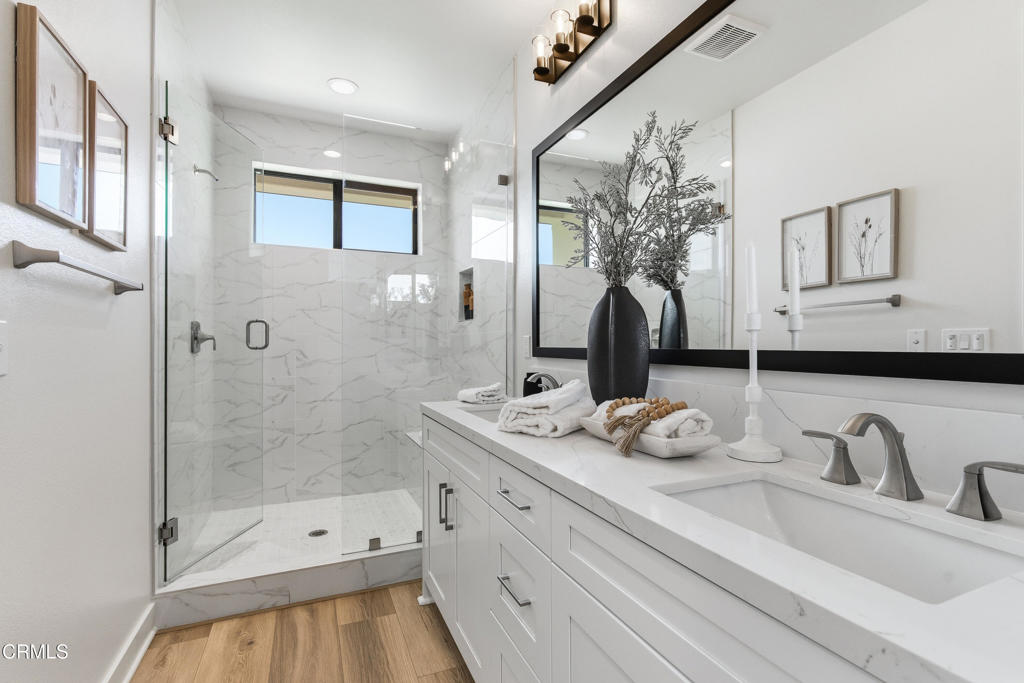 3245 Arrowhead Court Altadena, CA 91001 - Photo 17 of 37 a bathroom with a sink double vanity granite tub and shower