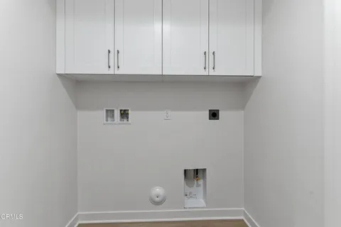 a view of cabinets and wooden floor