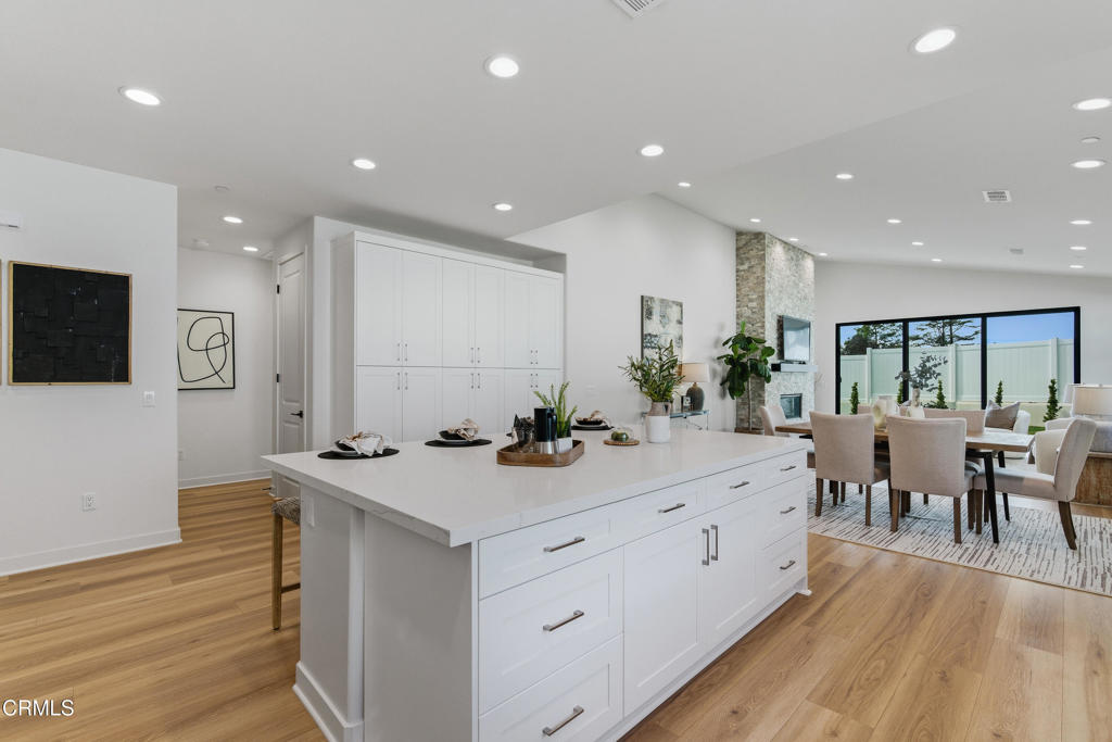 3245 Arrowhead Court Altadena, CA 91001 - Photo 8 of 37 a view of a center island table and chairs