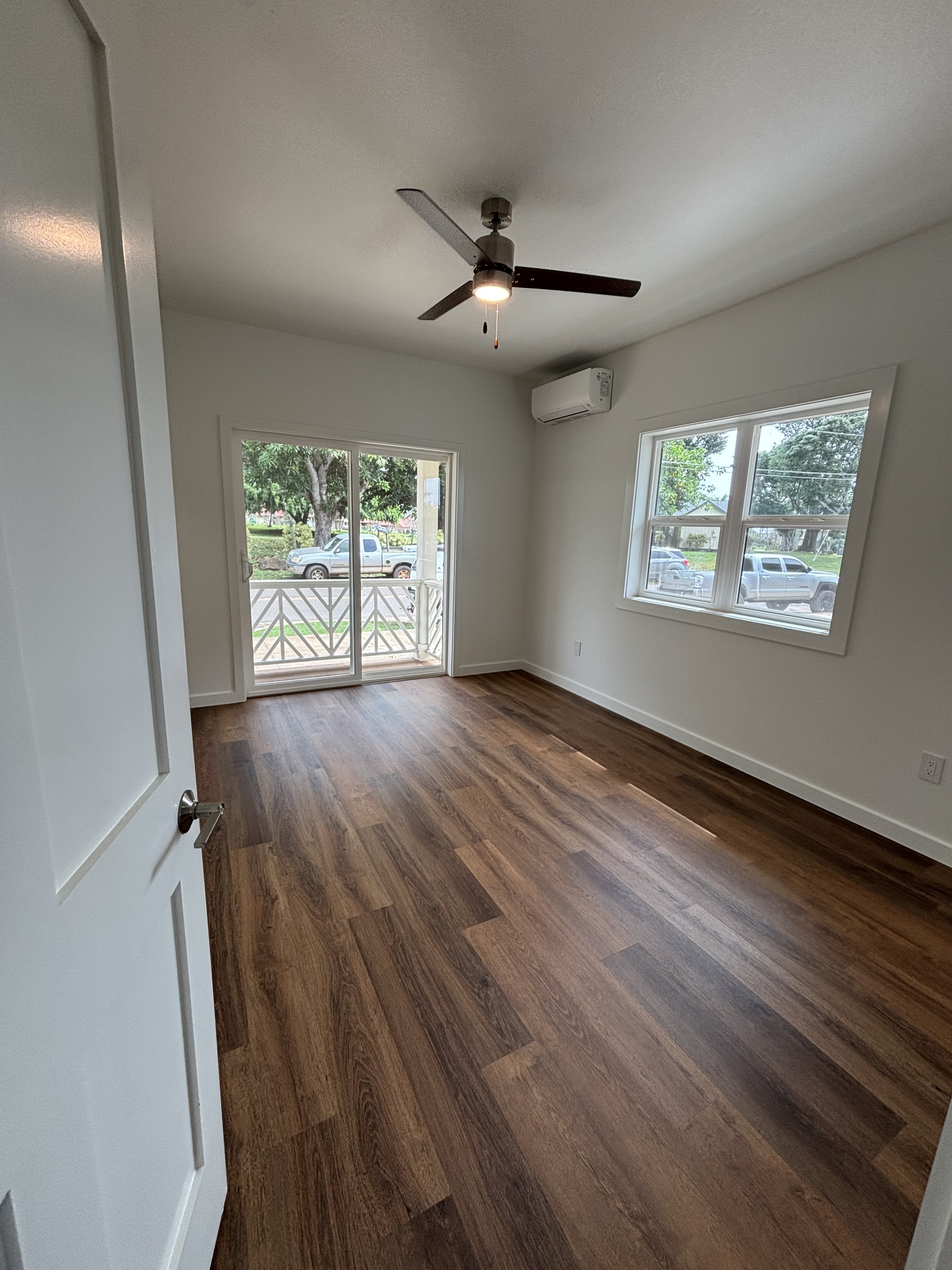 3451 Waikomo Road, Unit D102 Koloa, HI 96756 - Photo 11 of 15 a view of an empty room with wooden floor and a window