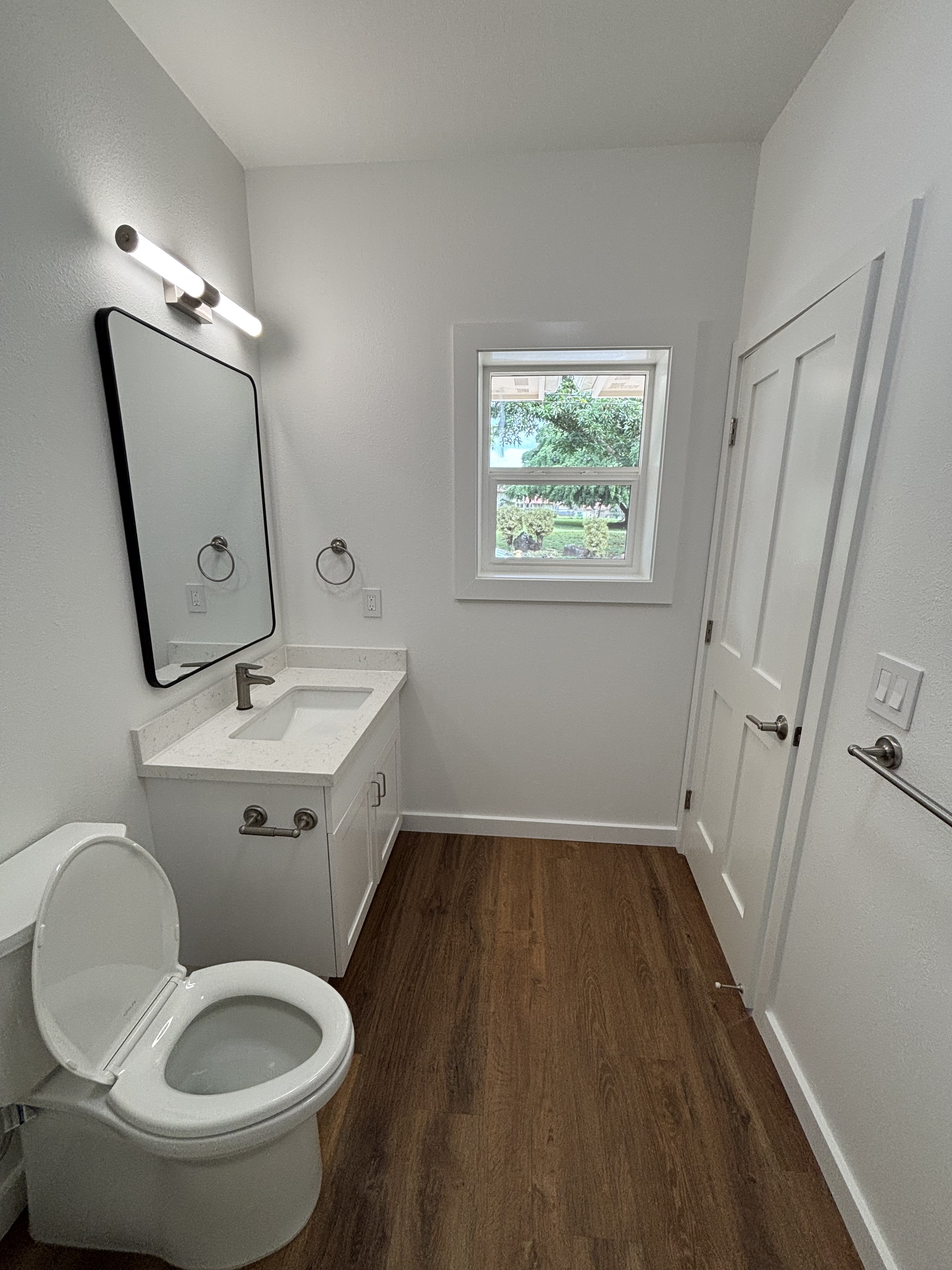 3451 Waikomo Road, Unit D102 Koloa, HI 96756 - Photo 14 of 15 a bathroom with a toilet sink and mirror