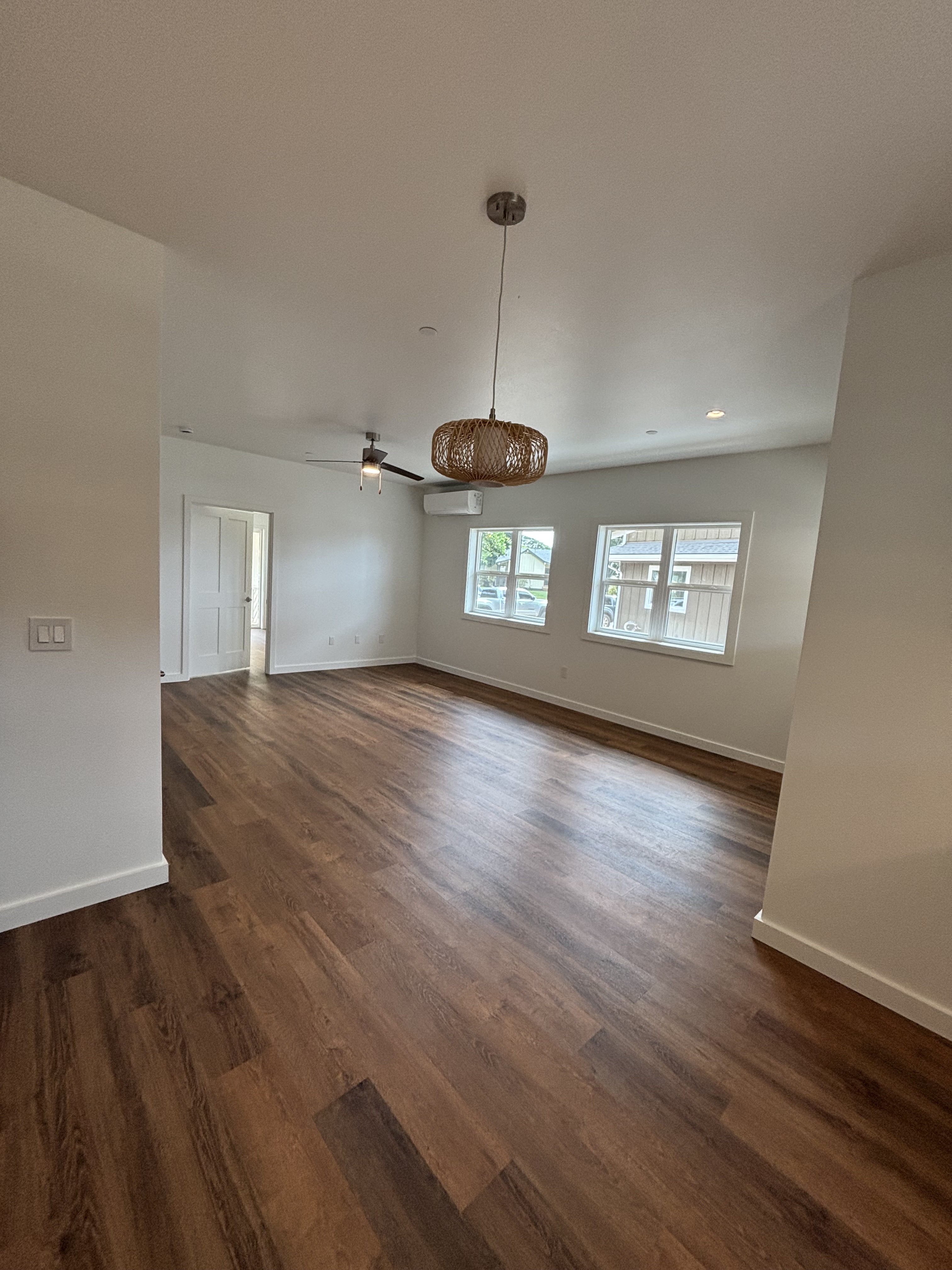 3451 Waikomo Road, Unit D102 Koloa, HI 96756 - Photo 4 of 15 a view of an empty room with wooden floor and a window