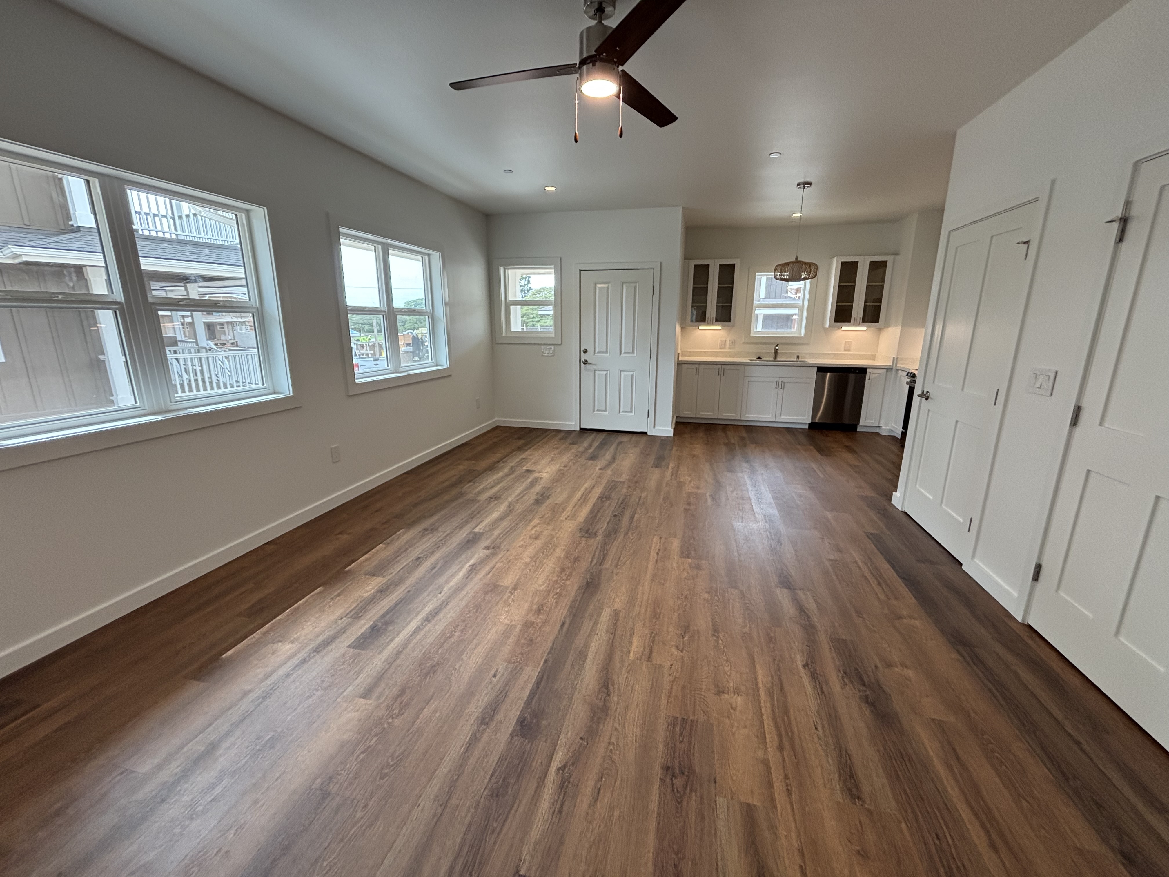 3451 Waikomo Road, Unit D102 Koloa, HI 96756 - Photo 6 of 15 wooden floor in an empty room with a window