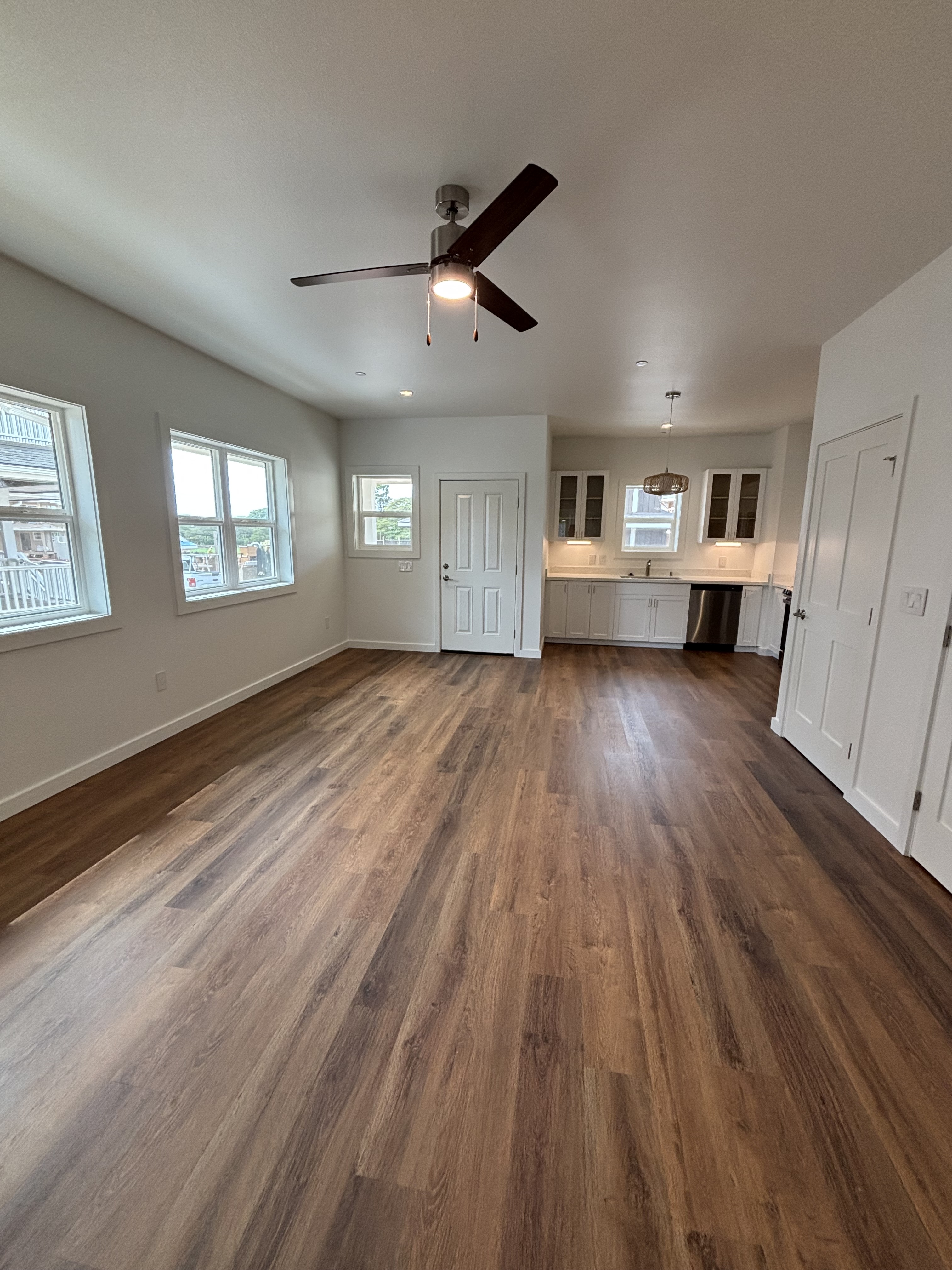 3451 Waikomo Road, Unit D102 Koloa, HI 96756 - Photo 7 of 15 a view of empty room with wooden floor and fan