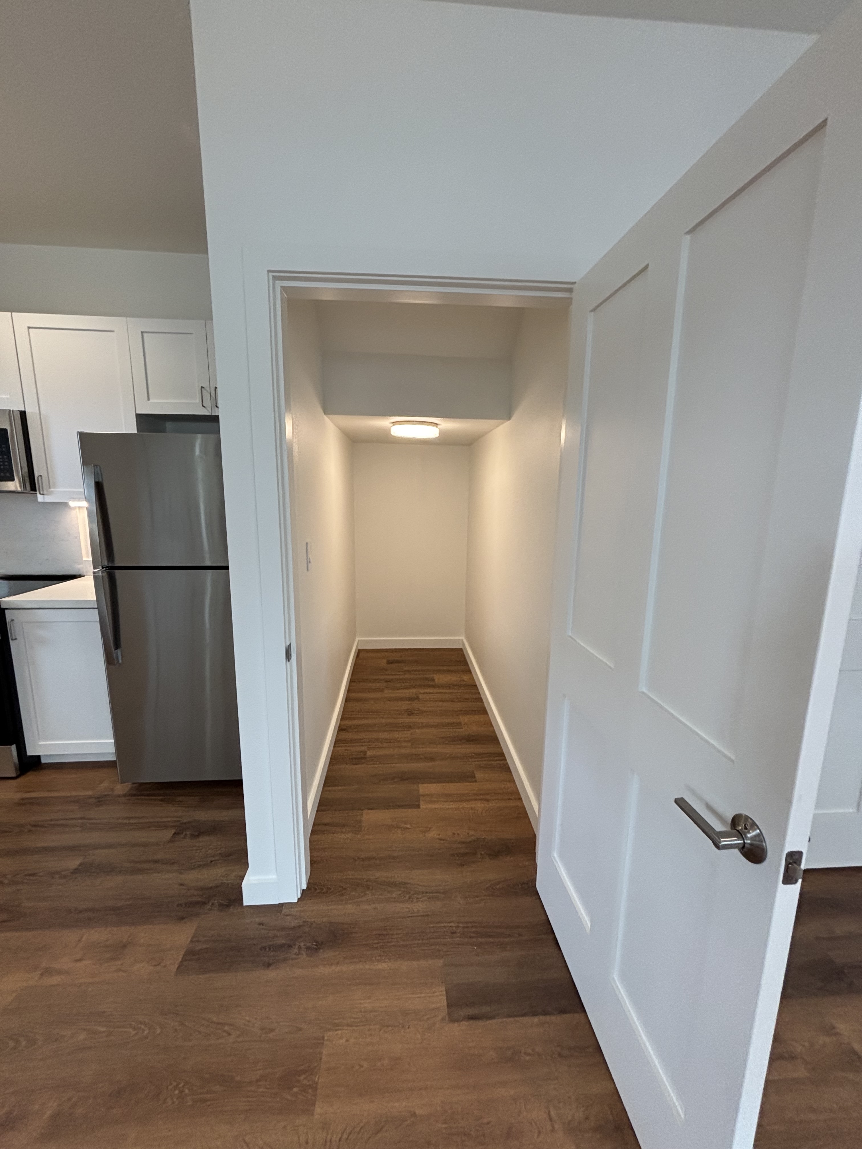 3451 Waikomo Road, Unit D102 Koloa, HI 96756 - Photo 9 of 15 a view of a hallway with wooden floor and stairs