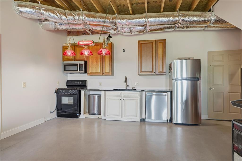 3326 Monument Road Jasper, GA 30143 - Photo 27 of 49 a kitchen with stainless steel appliances granite countertop a refrigerator and a stove