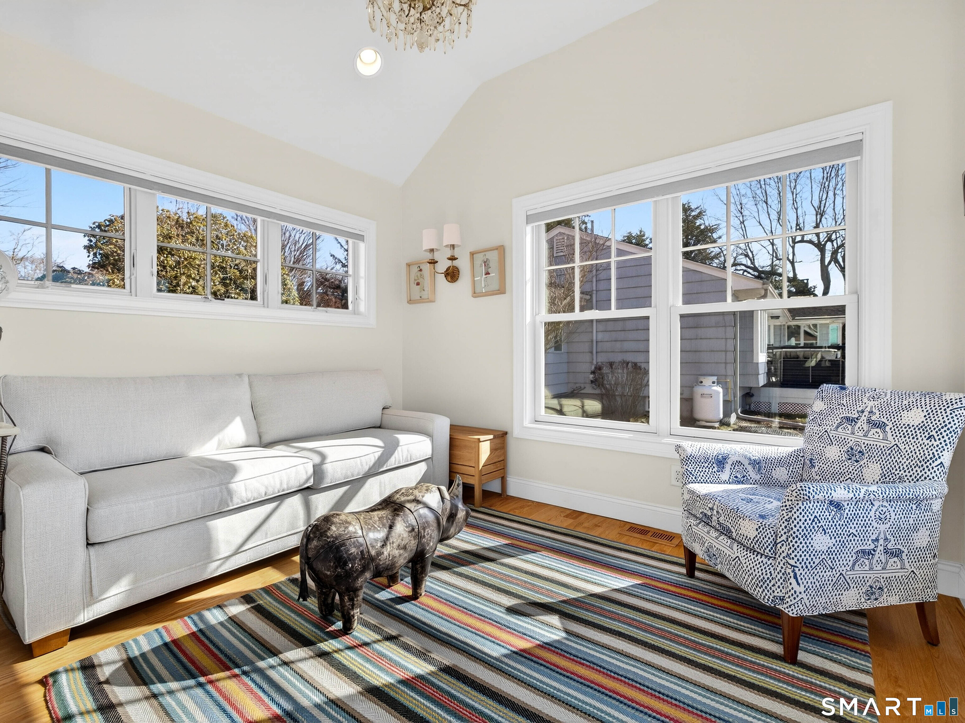 77 Masons Island Road Stonington, CT 06355 - Photo 13 of 35 a living room with furniture and a large window