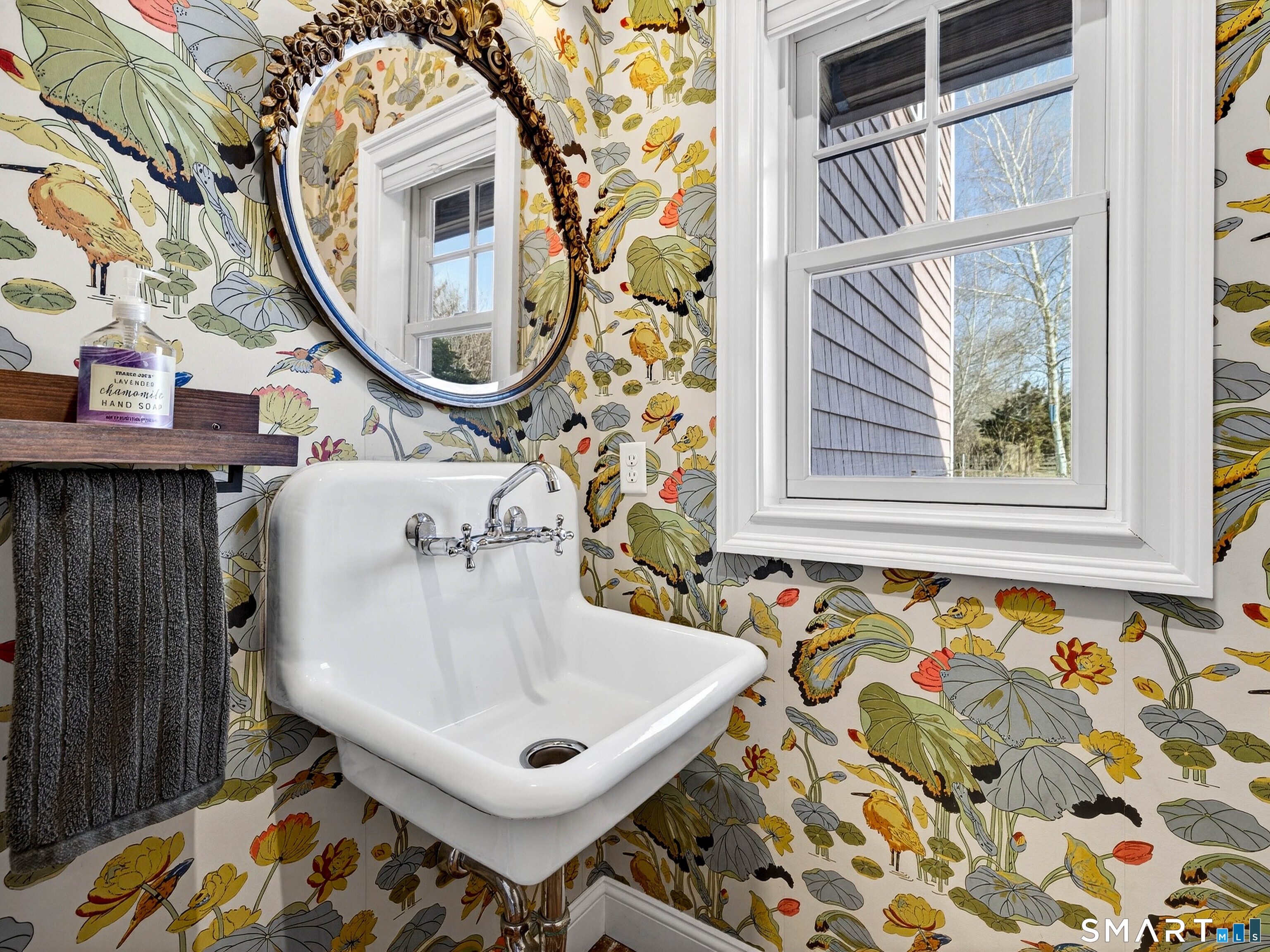 77 Masons Island Road Stonington, CT 06355 - Photo 15 of 35 a bathroom with a sink and mirror with bathtub