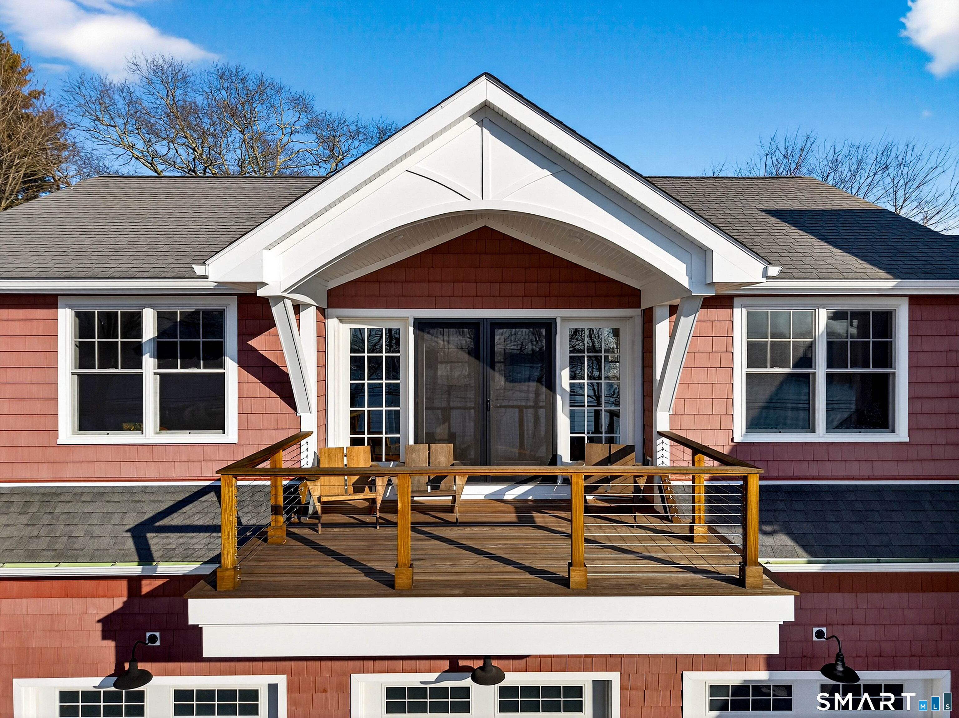 77 Masons Island Road Stonington, CT 06355 - Photo 16 of 35 a front view of a house with large windows