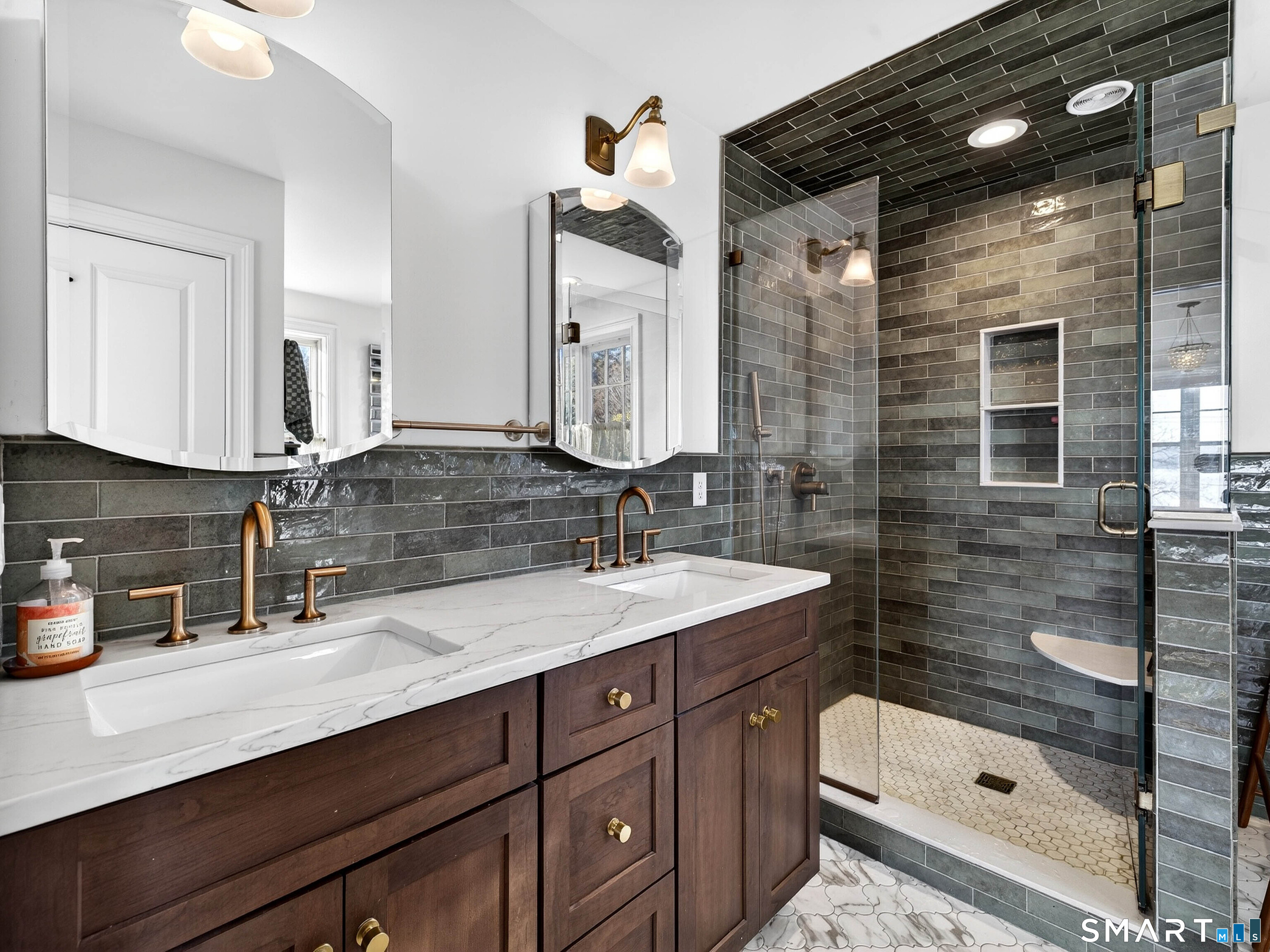 77 Masons Island Road Stonington, CT 06355 - Photo 18 of 35 a bathroom with a sink a vanity a mirror and shower