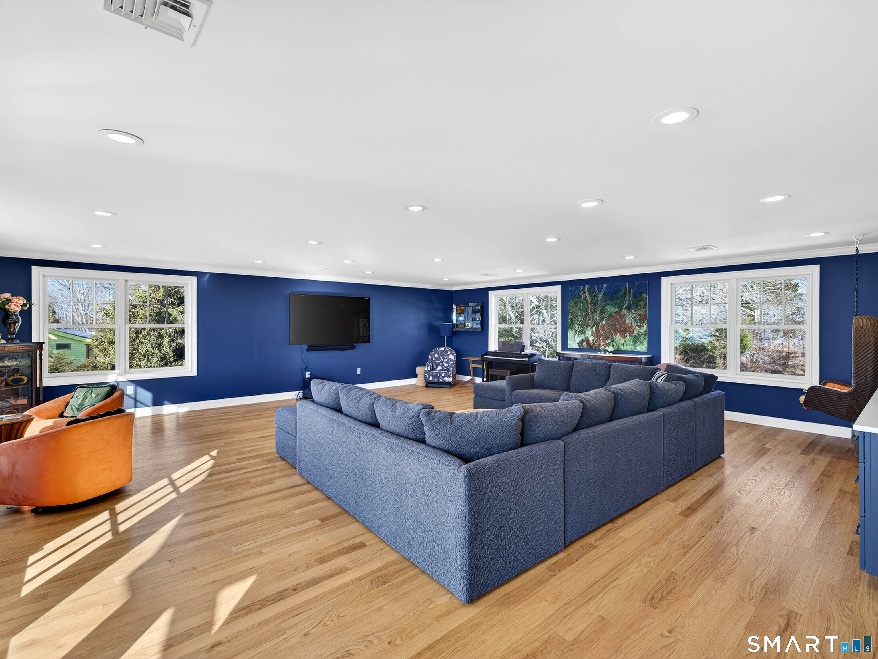 77 Masons Island Road Stonington, CT 06355 - Photo 21 of 35 a living room with furniture and a large window