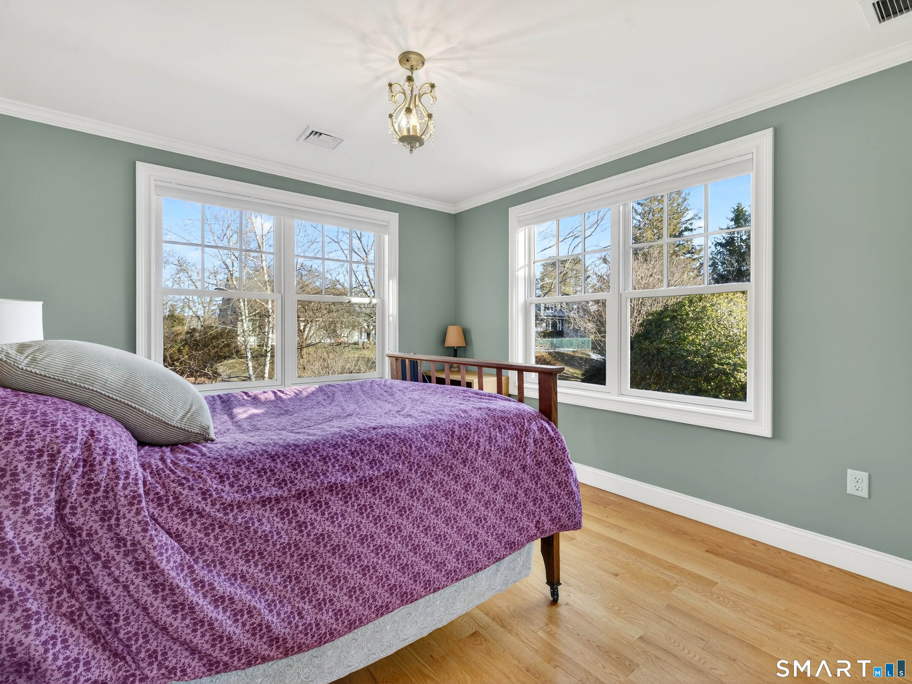 77 Masons Island Road Stonington, CT 06355 - Photo 27 of 35 a bedroom with a large bed and a window