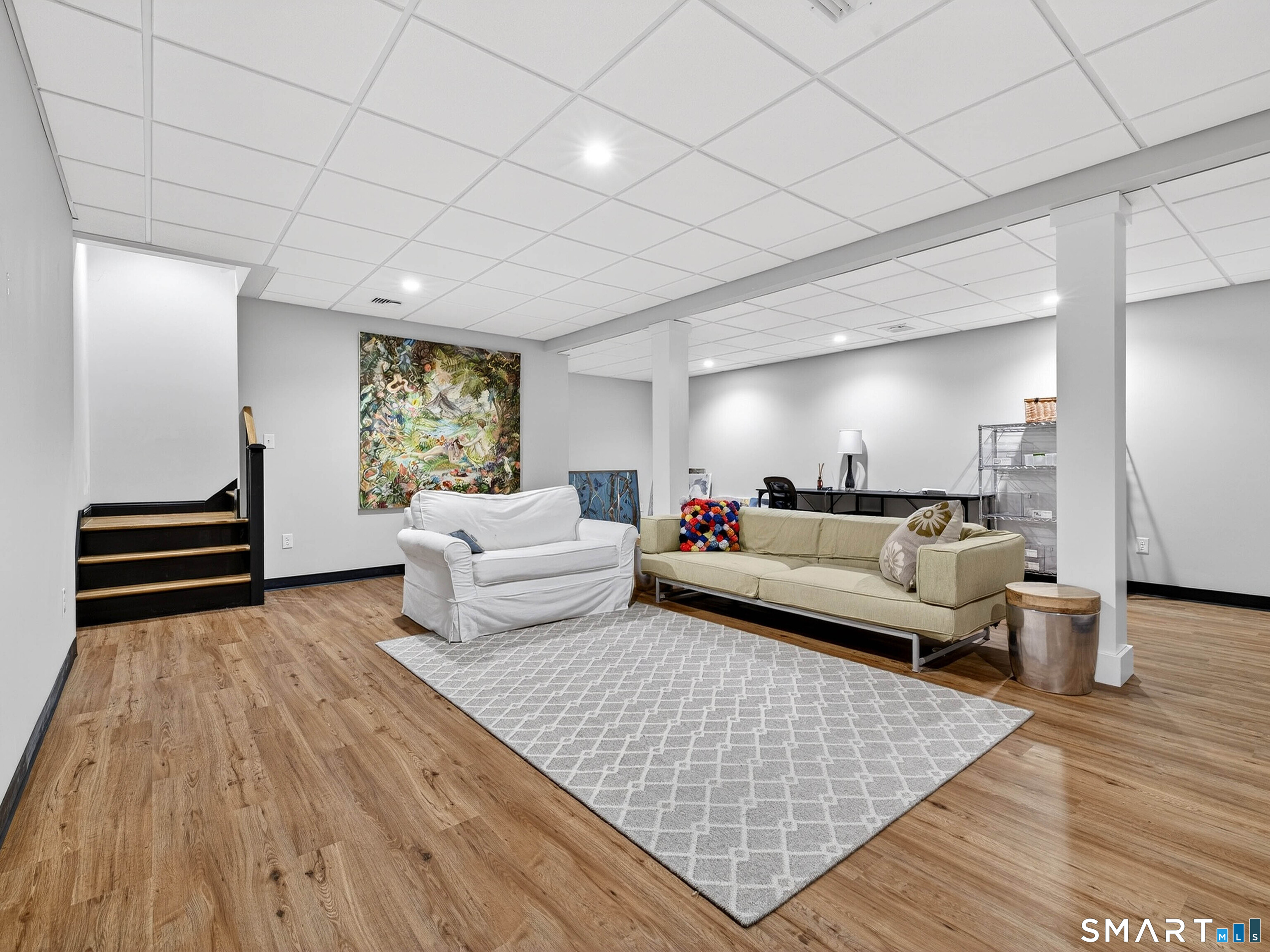 77 Masons Island Road Stonington, CT 06355 - Photo 30 of 35 a living room with furniture and a couch