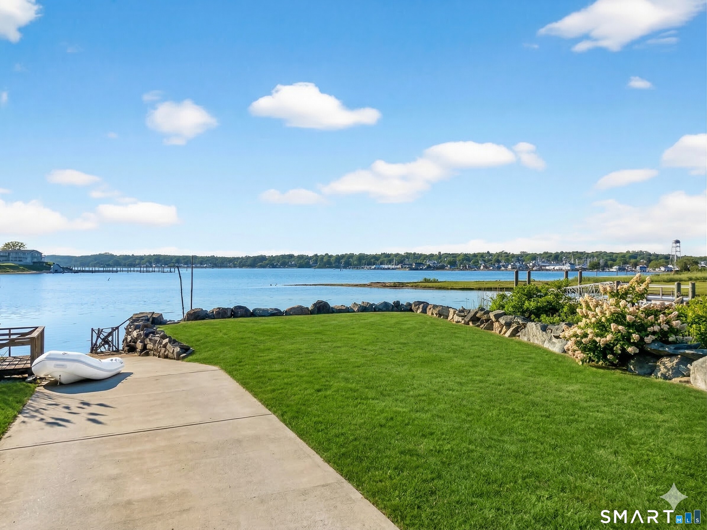 77 Masons Island Road Stonington, CT 06355 - Photo 33 of 35 a view of a garden and lake