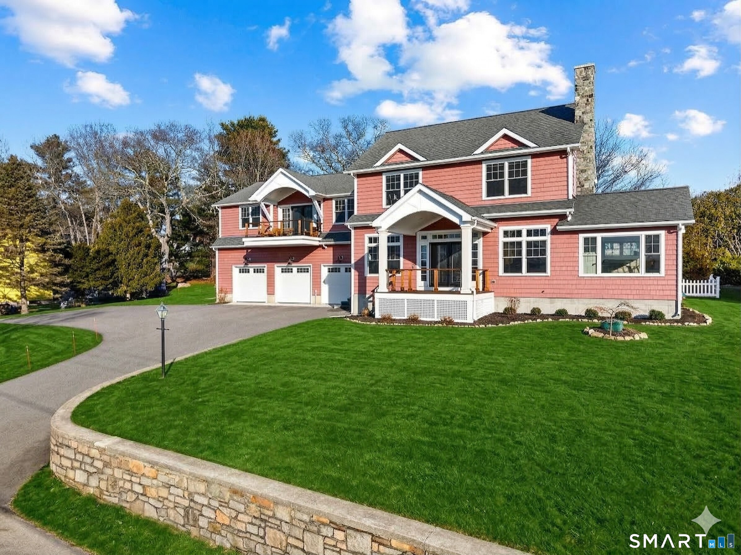 77 Masons Island Road Stonington, CT 06355 - Photo 35 of 35 a front view of a house with a yard
