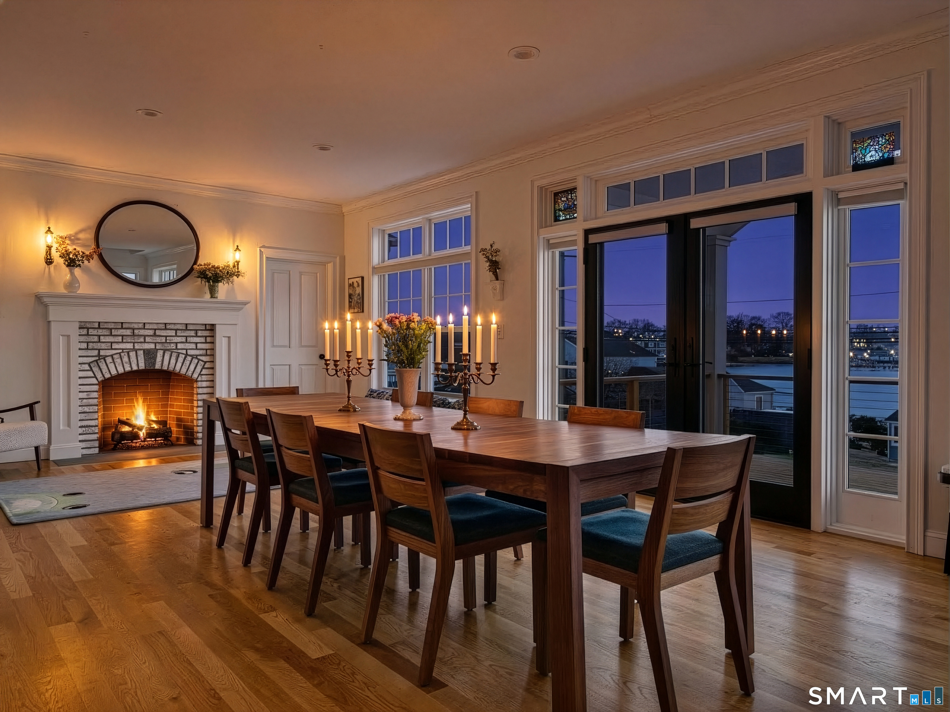 77 Masons Island Road Stonington, CT 06355 - Photo 6 of 35 a view of a dining room with furniture window and wooden floor