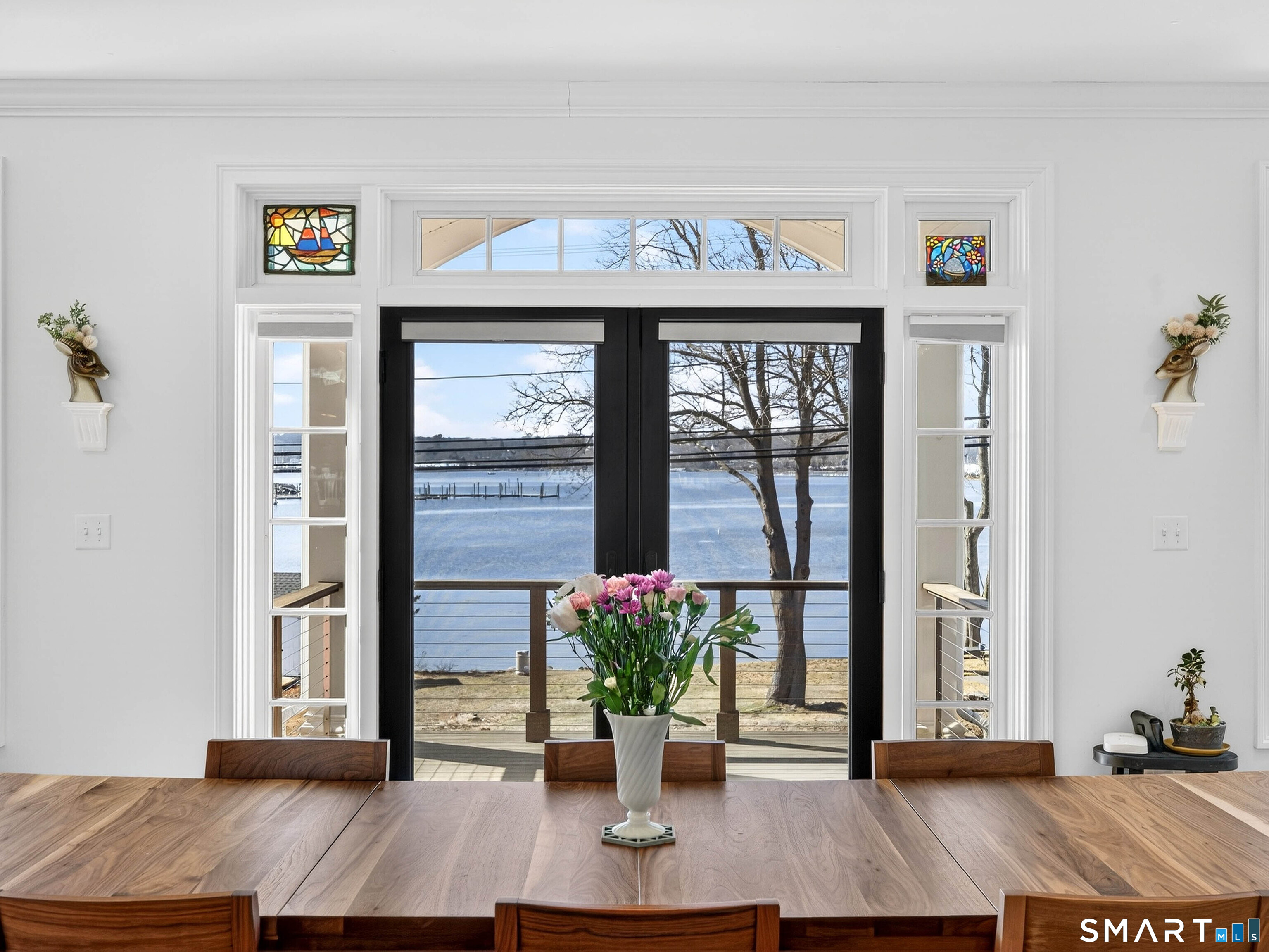 77 Masons Island Road Stonington, CT 06355 - Photo 7 of 35 a living room with furniture and a potted plant