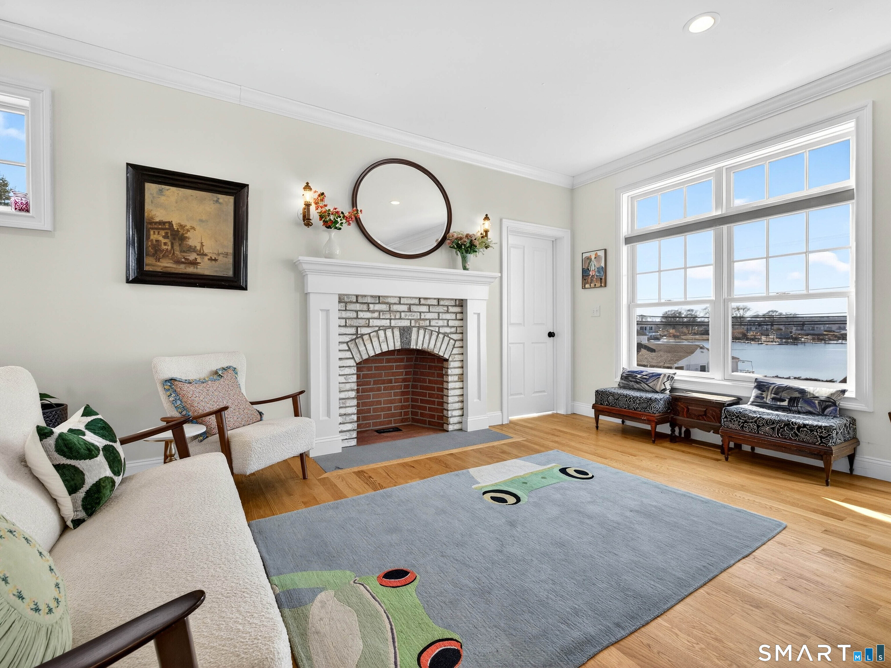 77 Masons Island Road Stonington, CT 06355 - Photo 8 of 35 a living room with furniture pool table and a fireplace