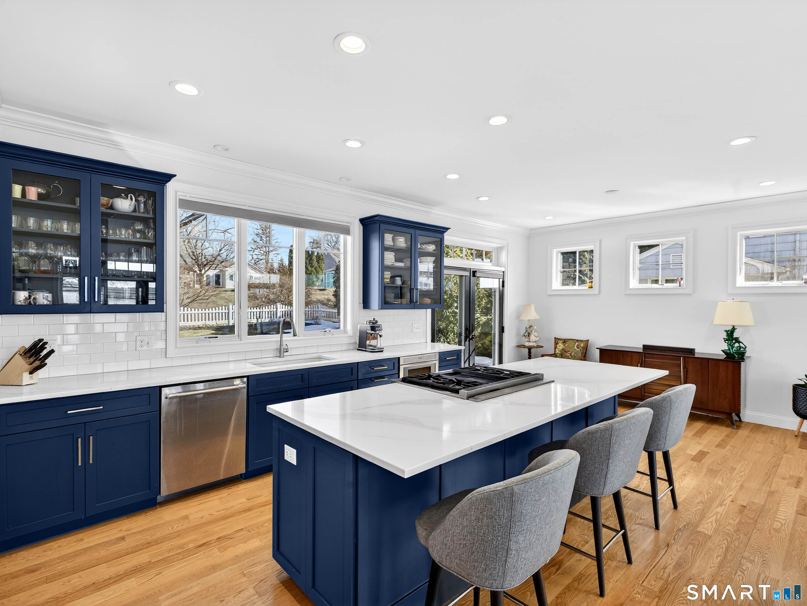 77 Masons Island Road Stonington, CT 06355 - Photo 10 of 35 a kitchen with a stove a sink dishwasher and a refrigerator with wooden floor