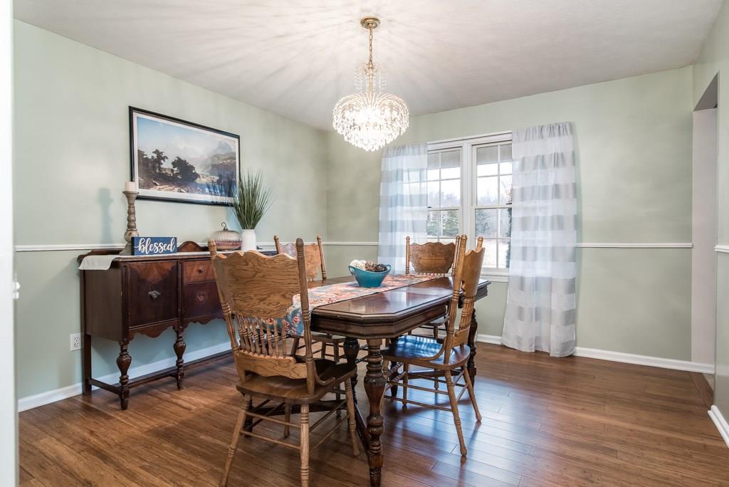225 Logan Road Valencia, PA 16059 - Photo 11 of 25 Bamboo hardwood floors and sparkling chandelier steal the attention in the dining room.